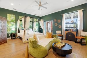 a bedroom with a bed and a couch at Casa Ybor Apartments on 7th Ave in Tampa