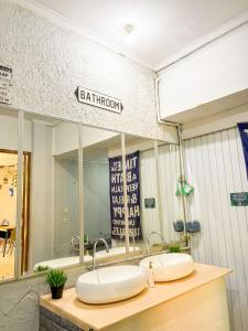 a bathroom with a sink and a mirror at OsteL By OstiC in Bandung +46 photos