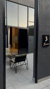 a room with a chair and a table in a building at شاليهات رون الفندقية in Medina