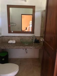 a bathroom with a sink and a mirror at Casa Puerto in El Garitón +14 photos