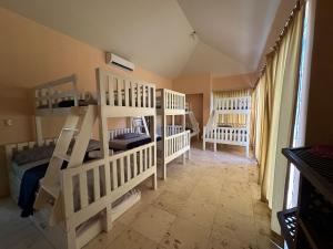 a room with two bunk beds in a room at Casa Puerto in El Garitón