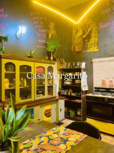 a kitchen with a table and a counter top at Hostal Casa Margarito in Guadalajara