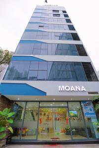 a building with a mama store in front of it at Moana Hotel Nha Trang in Nha Trang