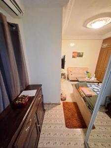 a room with a bed and a living room at Casabella in Dakar +6 photos