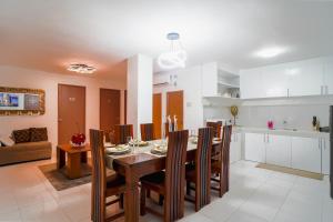 a kitchen and dining room with a table and chairs at The P Residences in San Agustin +19 photos
