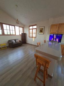 a large living room with a table and a couch at Villa Luna in Chincha
