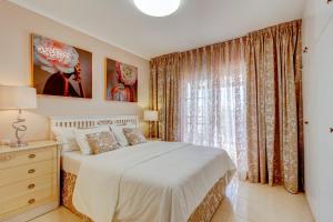 a bedroom with a bed and a large window at Ocean View 3bedroom Villa with pool in Callao Salvaje +35 photos