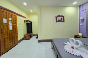 a hospital room with a bed with a flower on it at Smilingface guesthouse in Sukhothai +84 photos