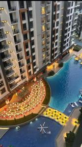 an overhead view of a large pool with buildings at K Avenue by FRHome, 2 bedroom apartment within 5 min to KKIA airport in Kota Kinabalu