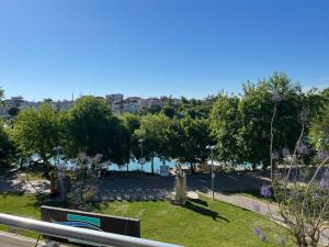 a view of a park with trees and grass at River suite hotel in Manavgat
