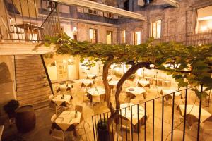 a restaurant with tables and chairs in a building at Casa Alla Lega in Arco