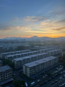 an aerial view of a city with buildings and a parking lot at K Avenue by FRHome, 2 bedroom apartment within 5 min to KKIA airport in Kota Kinabalu