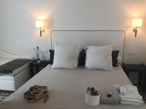 A bed or beds in a room at Hotel Capanni