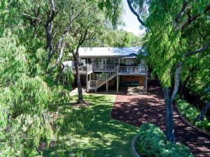 an aerial view of a house surrounded by trees at Edgewater on Quindalup Beachfront in Quindalup +19 photos