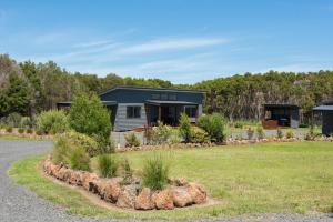 a house with a garden in front of it at The Gap Retreat in Cowes