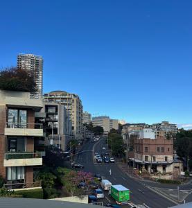 a view of a city street with cars and buildings at Edgecliff Lodge Motel in Sydney +62 photos