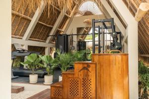 a room with a bunch of plants in it at Hotel Together Bali in Uluwatu +70 photos