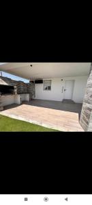 a view of a room with a large room with at chalecito con piscina y barbacoa in Benicarló