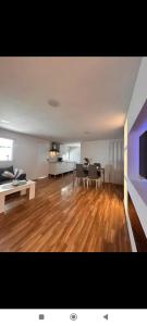 a large living room with wooden floors and a living room at chalecito con piscina y barbacoa in Benicarló