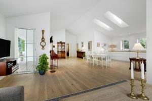an empty living room with a dining room and a living room at New And Cozy House By The Beach And Forest in Hornbæk