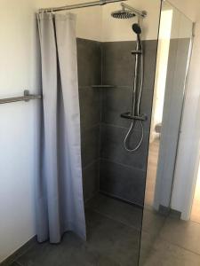 a shower with a shower curtain in a bathroom at New Modern Holiday Home Near The Beach And City in Nykøbing Sjælland +19 photos