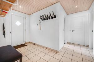 a room with a white wall and a door at Cozy And Spacious Townhouse In Aars in Års +16 photos