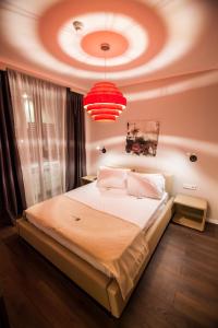Postel nebo postele na pokoji v ubytování Cluj Business Class