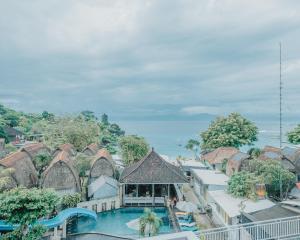 an aerial view of a resort with a swimming pool at The Tanis Beach Resort Nusa Lembongan in Nusa Lembongan