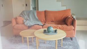 a living room with a couch and a table at Rural Cottage With Views Over Herrljunga in Ljung