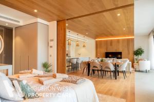 a living room with a couch and a dining room at The Horizon - Luxury 3-Bedroom with Private Plunge Pool and Terrace, South Residences, Higueron Resort, Fuengirola in Fuengirola