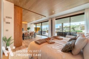a bedroom with a large bed and a balcony at The Horizon - Luxury 3-Bedroom with Private Plunge Pool and Terrace, South Residences, Higueron Resort, Fuengirola in Fuengirola +32 photos
