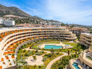 an aerial view of a building with a swimming pool at The Horizon - Luxury 3-Bedroom with Private Plunge Pool and Terrace, South Residences, Higueron Resort, Fuengirola in Fuengirola