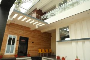 a modern house with a glass roof at Lumiere Point Yercaud in Yercaud