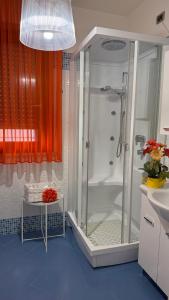 a bathroom with a shower and a sink at Sea Colors Apartment in Montesilvano +40 photos