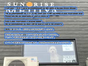 a computer screen with a sign that reads sunrase at Sunrise Meiji-ya in Nozawa Onsen