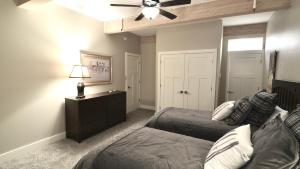 a bedroom with two beds and a ceiling fan at Sun Valley Adventures Heated Pool & Spa in Ketchum