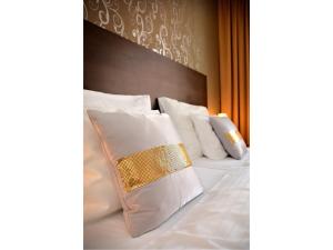 Voodi või voodid majutusasutuse Hotel Atrium toas