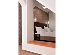 Voodi või voodid majutusasutuse Hotel Atrium toas