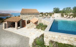 an image of a villa with a swimming pool at Villa Cima in Vrbnik