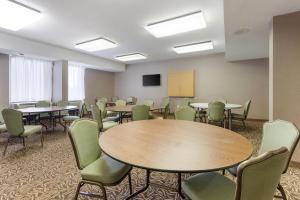 a conference room with tables and chairs and a podium at Comfort Inn Ebensburg in Ebensburg +31 photos