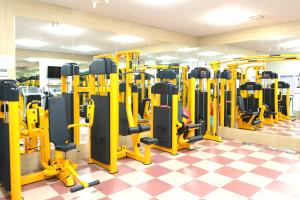 a gym with a lot of tread machines at Geoje Residence Hotel in Geoje