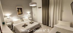 a hotel room with two beds in a room at Papadioti Apartments in Pefki