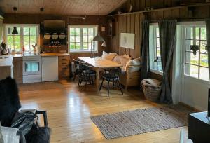 a kitchen and dining room with a table in a room at Cabin With Rauland Mountain Views in Rauland