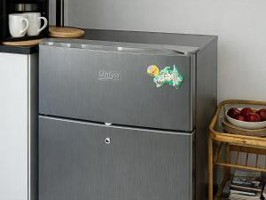 a refrigerator with a sticker on it in a kitchen at At Lilac Cottage, Jeffreys Bay Cozy stay for 2 & Business traveling in Jeffreys Bay