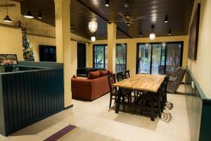 a living room with a table and a couch at Valhalla Villa in Panvel
