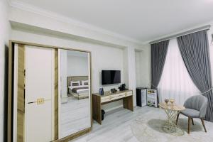 a rendering of a hotel room with a bedroom at Bog’ishamol Hotel Urgut in Min-Bulak