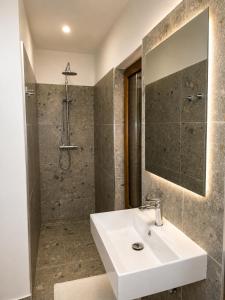 a bathroom with a sink and a shower at Villa Nova Resort with pool in Sveti Peter +45 photos