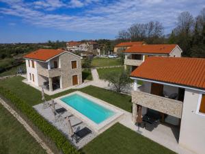 an aerial view of a house with a swimming pool at Villa Nova Resort with pool in Sveti Peter