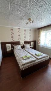 a bedroom with a bed and a coffered ceiling at Vacation Home Yoanna in Tryavna +21 photos