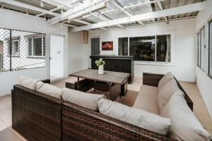 a living room with a couch and a table at Iconic Escape Nowra in Nowra
